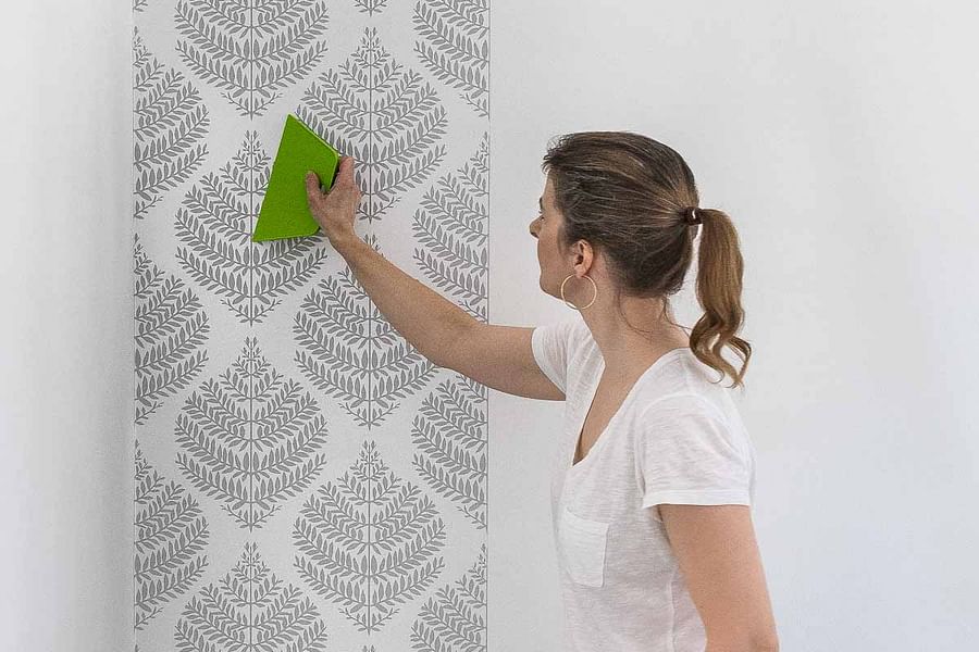 cutting wallpaper around outlet